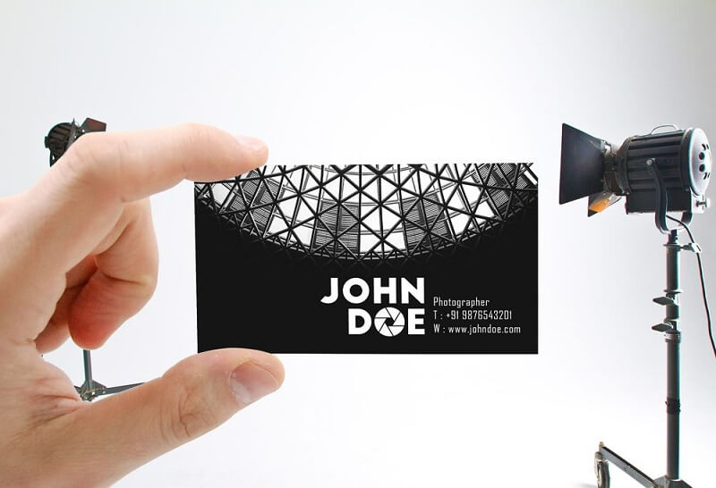 Male Hand holding Business Card